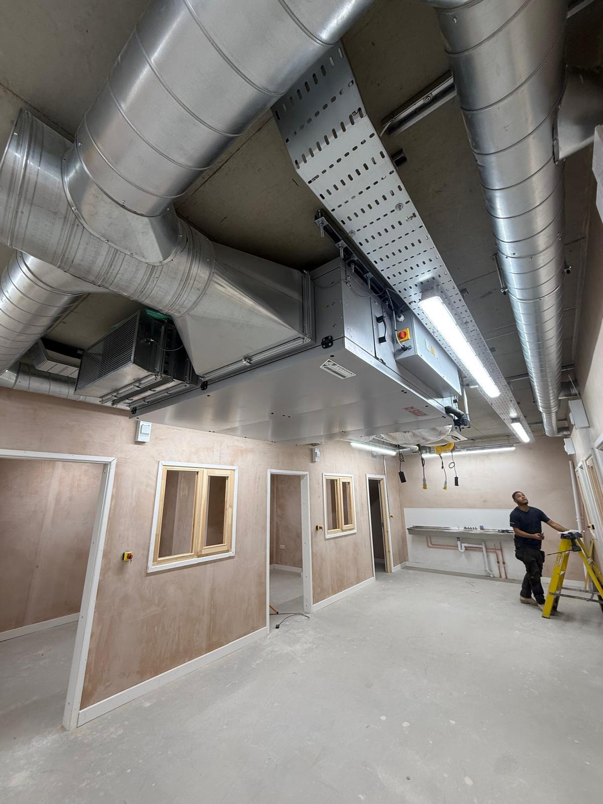 Commercial installation with lighting, containment and air handling equipment