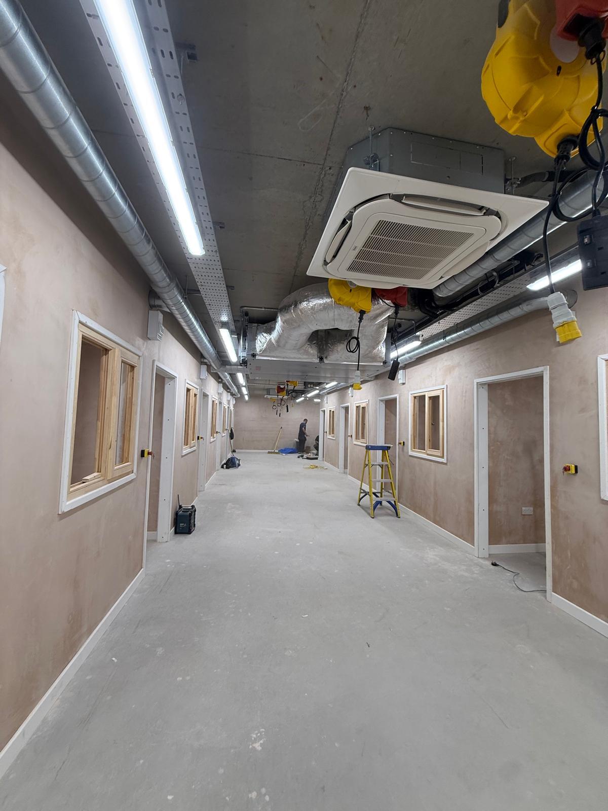 Commercial corridor lighting and containment installation