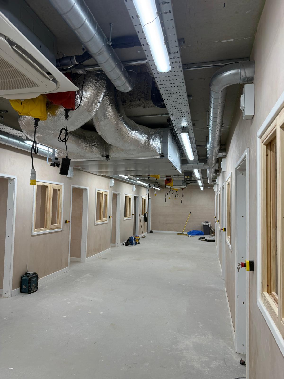 Overview of commercial electrical installation with lighting and containment