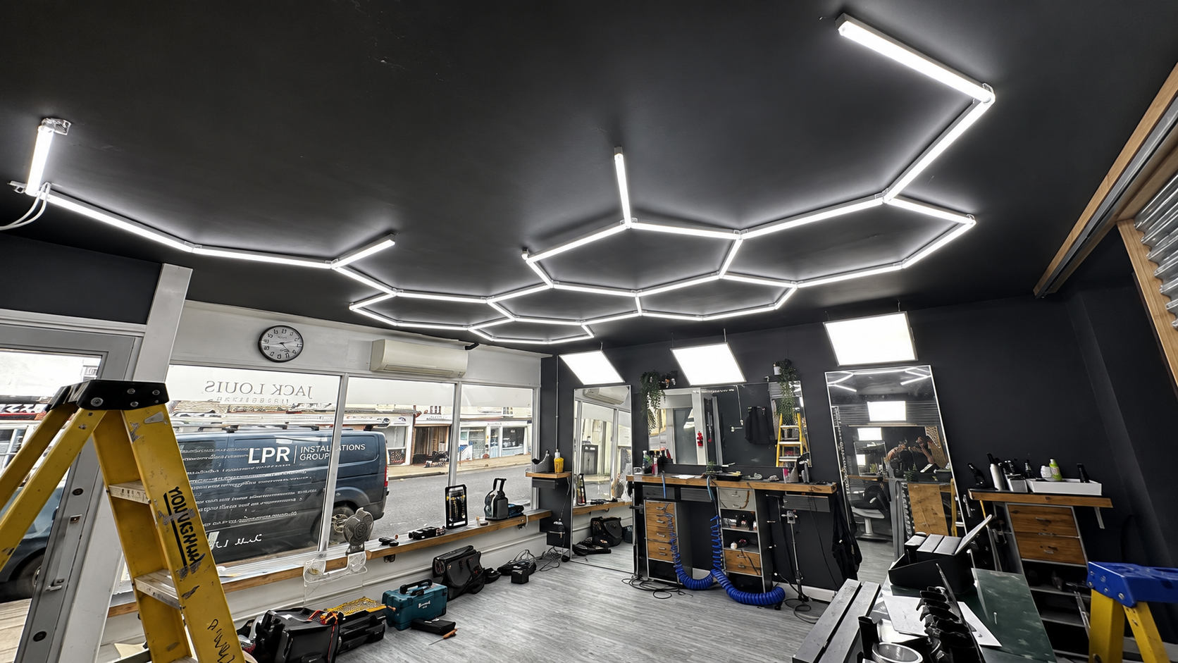 Bespoke hexagon LED ceiling lighting installed by LPR in a hair salon
