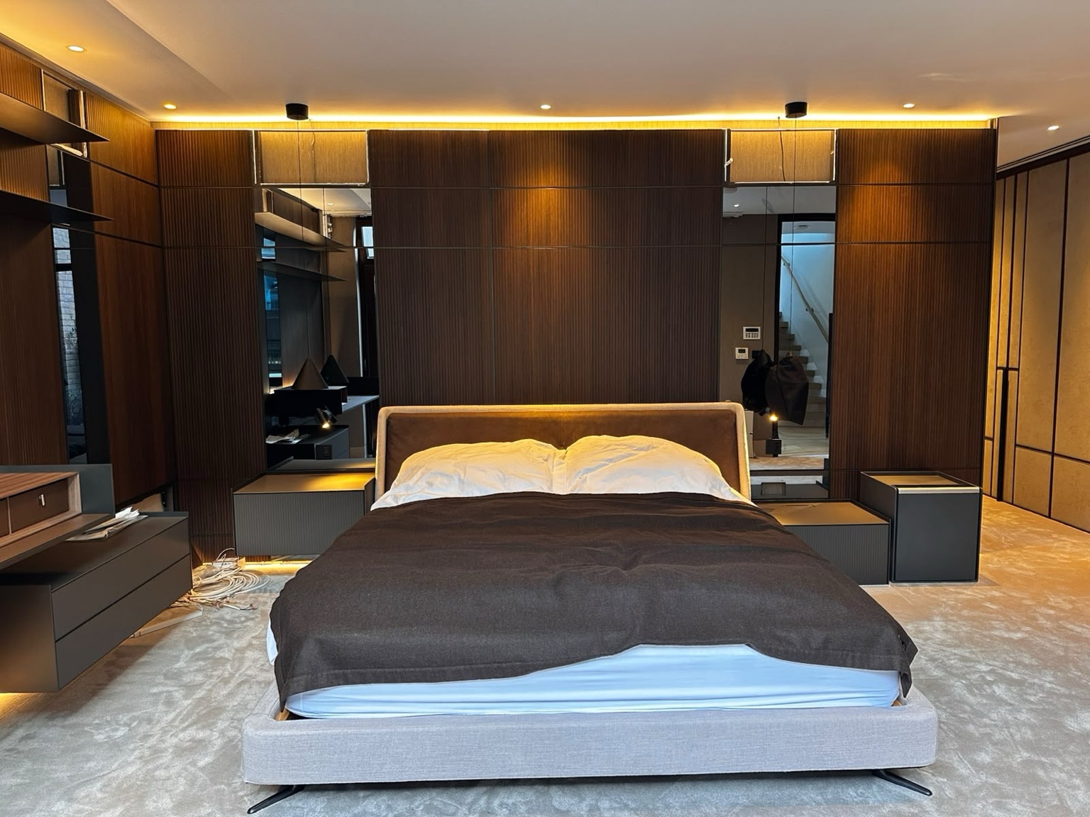 Bespoke bedroom with integrated LED lighting and downlights completed by LPR alongside Rimadesio